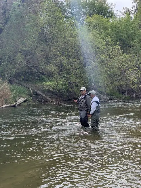 An angler being taught how to fish