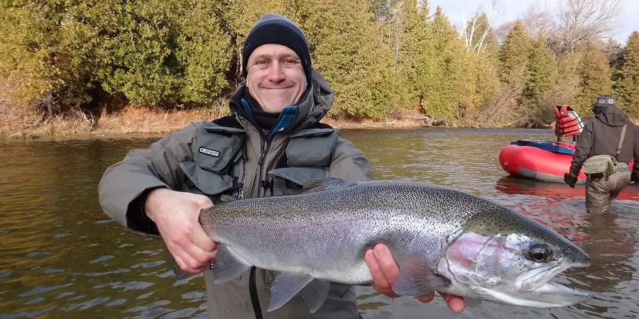 A client of A Perfect Drift Guide Company with a big late fall steelhead