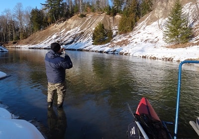 An angler fishing for winter steelhead