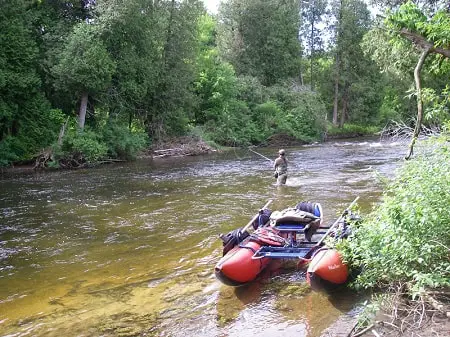On of my buddies fishing on one of the best trout rivers in Ontario boat.