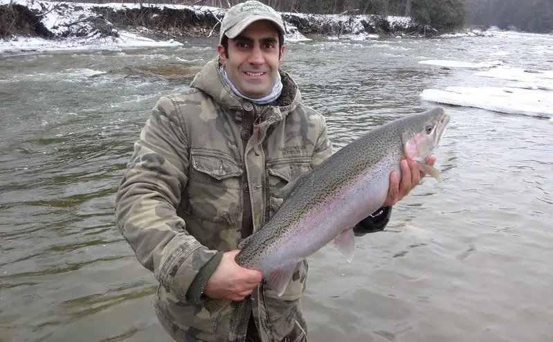 This is my client with one of seven big steelhead. Wearing a winter coat is perfectly acceptable.