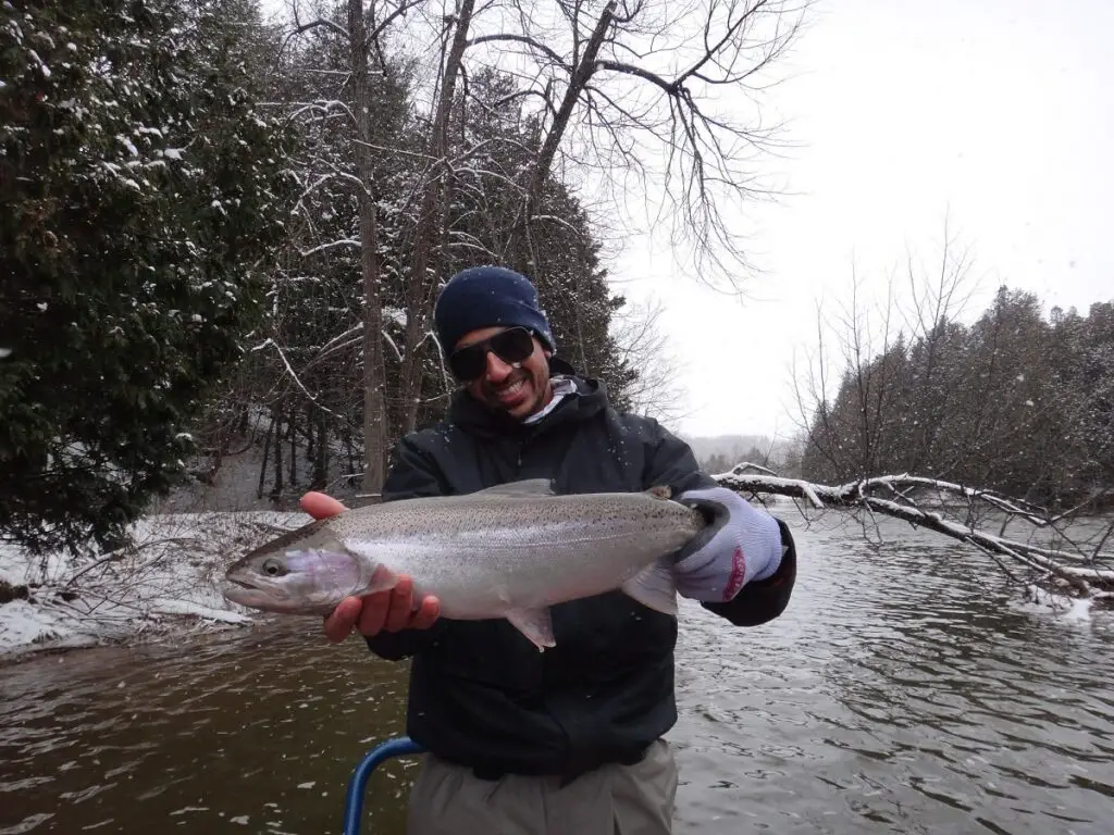 This is my client holding one of 13 steelhead he caught on this day in minus 13 Celsius or 8.6 Fahrenheit.
